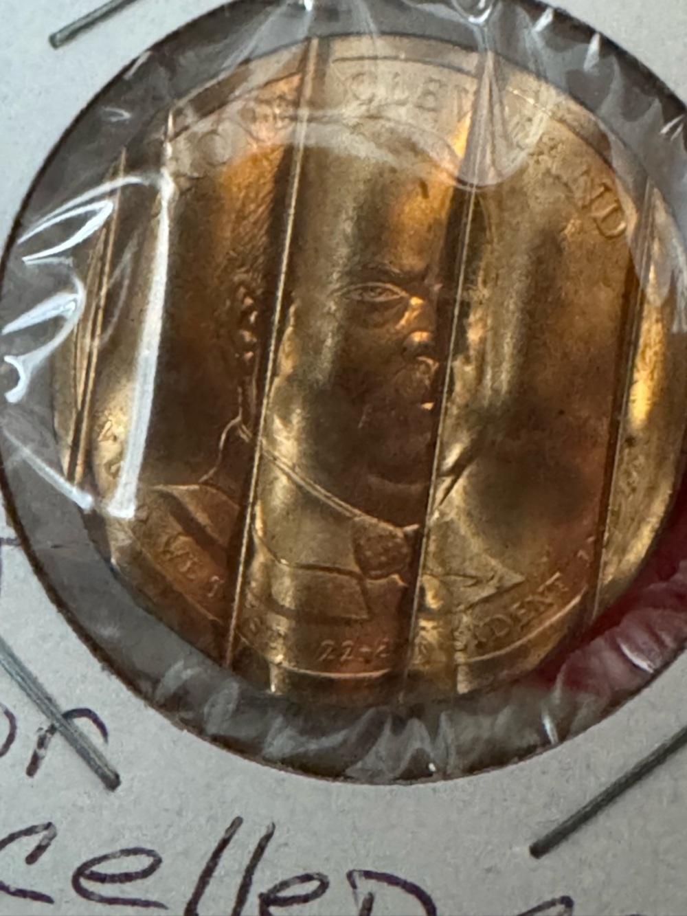 Copper Tone Presidential Grover Cleveland cancelled waffle dollar coin.